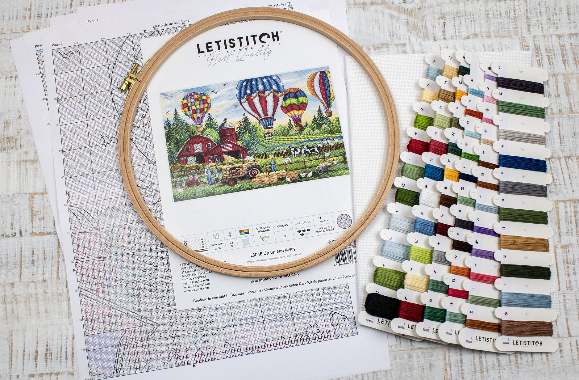 Up Up and Away L8048 Counted Cross Stitch Kit featuring colorful threads, Aida canvas, and detailed instruction chart.